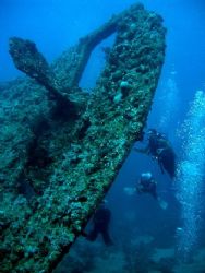 The famous Thistelgorm wreck and three fellow divers. Thi... by Steven Withofs 